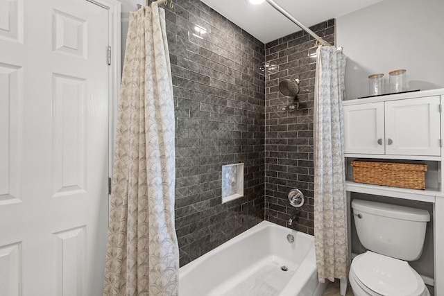 full bathroom featuring shower / bath combo and toilet