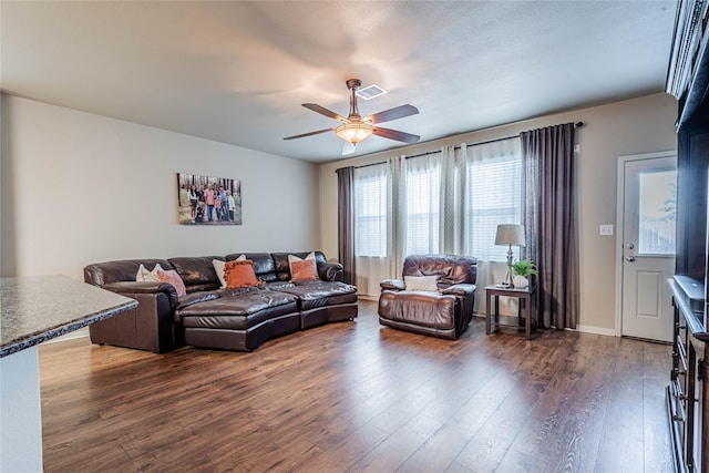 living area with ceiling fan, dark wood-style floors, and visible vents