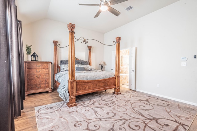 bedroom featuring ceiling fan, visible vents, baseboards, light wood finished floors, and lofted ceiling