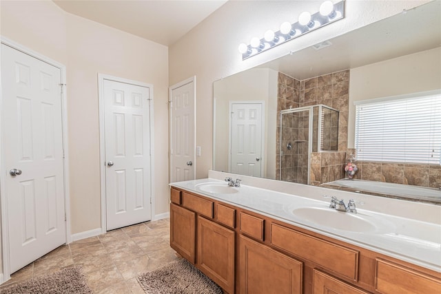 full bathroom featuring a sink, a shower stall, double vanity, and visible vents