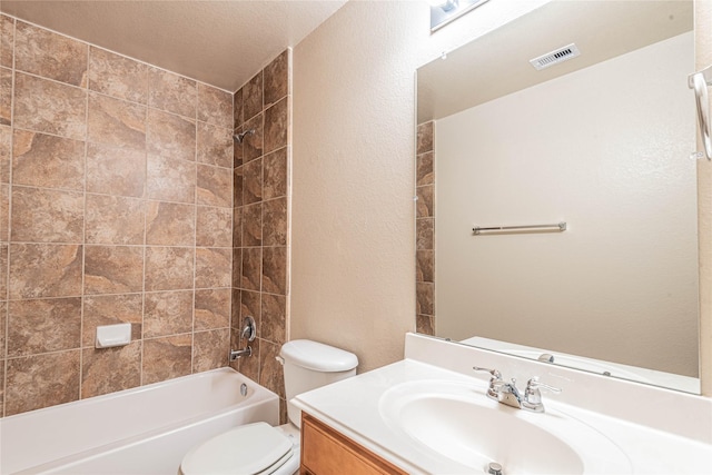 full bathroom with a textured wall, vanity, toilet, bathing tub / shower combination, and visible vents