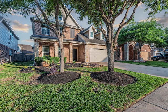 view of front of property with brick siding, fence, driveway, and a front lawn
