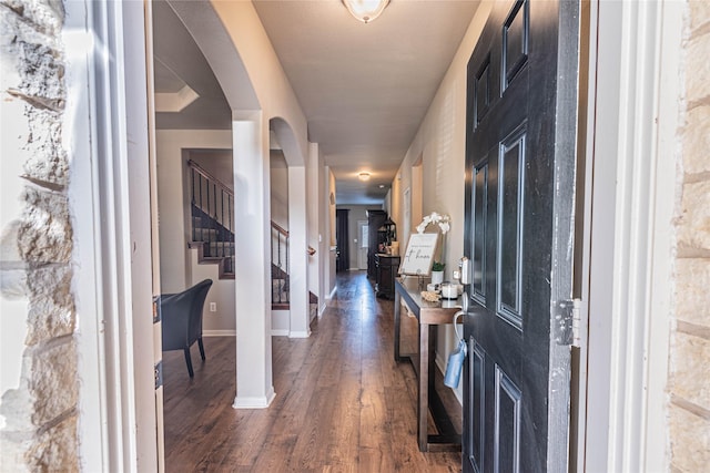 foyer with stairs, baseboards, and dark wood-style floors