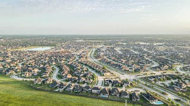 birds eye view of property with a residential view and a water view