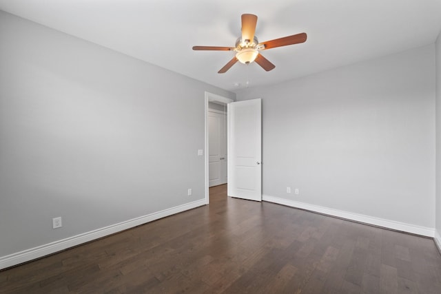 empty room featuring baseboards, ceiling fan, and wood finished floors