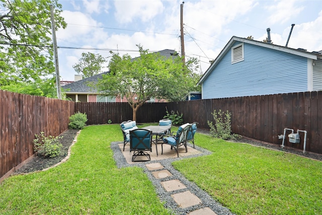 view of yard with a fenced backyard and a patio area