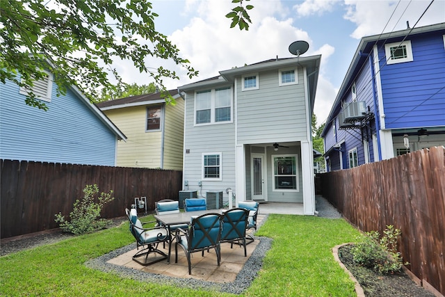 back of property with ceiling fan, a patio, a fenced backyard, a lawn, and central air condition unit