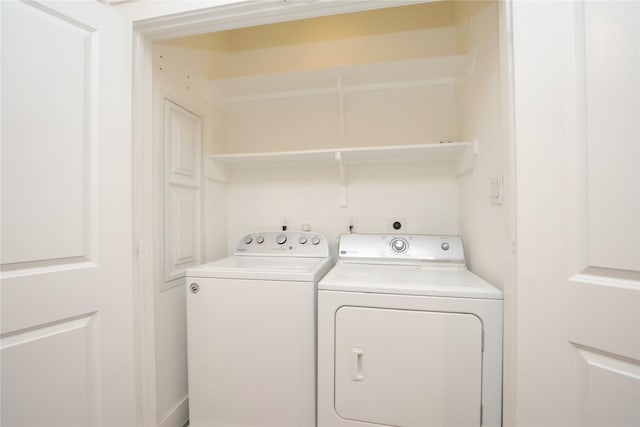 washroom featuring laundry area and independent washer and dryer