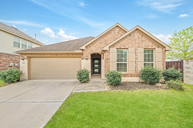 single story home featuring a shingled roof, brick siding, a garage, a front yard, and concrete driveway