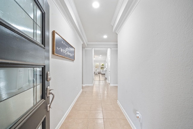 hall featuring light tile patterned floors, baseboards, ornamental molding, and recessed lighting