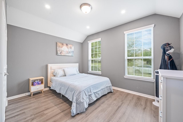 bedroom featuring recessed lighting, baseboards, vaulted ceiling, and light wood-type flooring