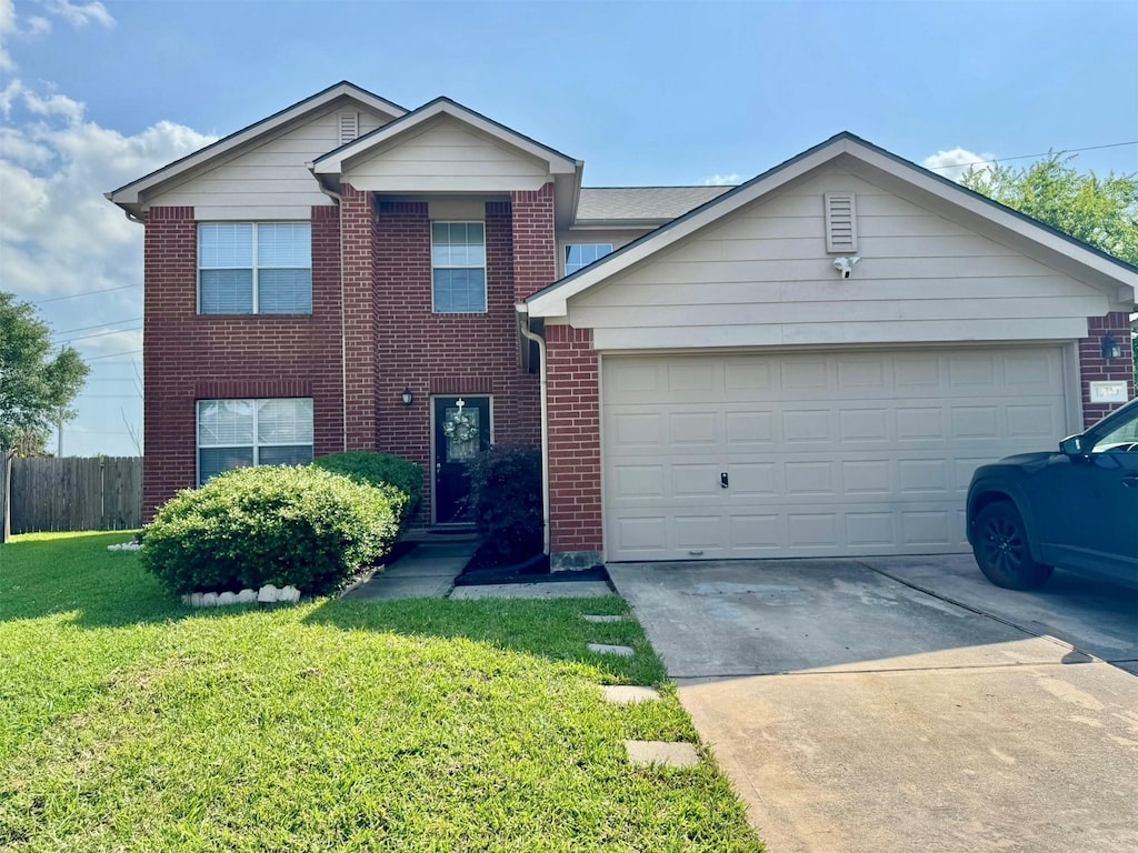 view of front of house featuring fence, brick siding, a garage, a front yard, and driveway