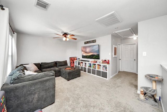 15519 Hensen Creek Dr, Houston, TX 77086 - carpeted living area featuring attic access, a ceiling fan, and baseboards