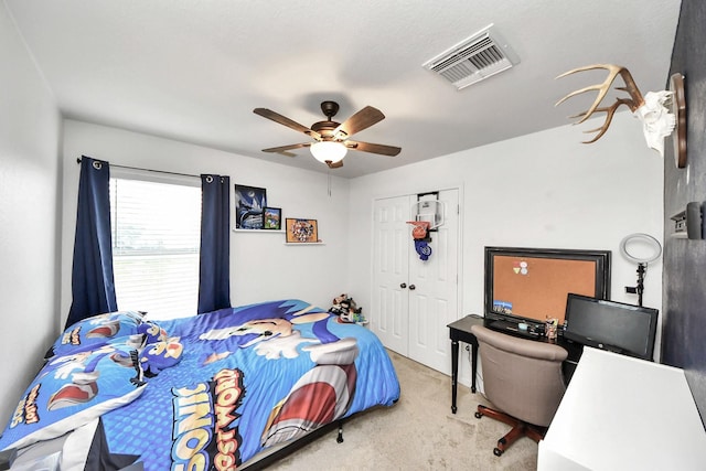 15519 Hensen Creek Dr, Houston, TX 77086 - bedroom with carpet, a closet, and ceiling fan