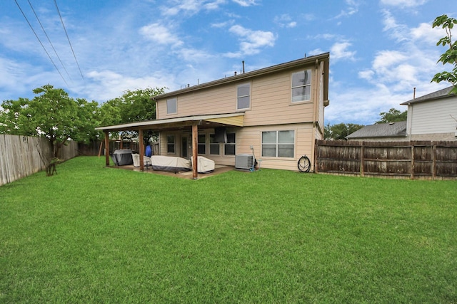 15519 Hensen Creek Dr, Houston, TX 77086 - rear view of property with central AC and a patio area