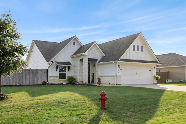 traditional home with fence, board and batten siding, driveway, and a garage