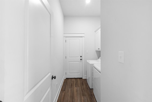 corridor featuring separate washer and dryer, baseboards, and dark wood-style floors
