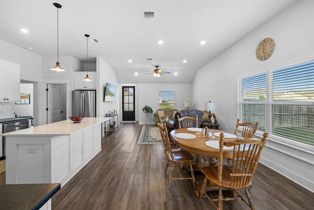 dining space featuring ceiling fan, recessed lighting, baseboards, lofted ceiling, and dark wood-type flooring