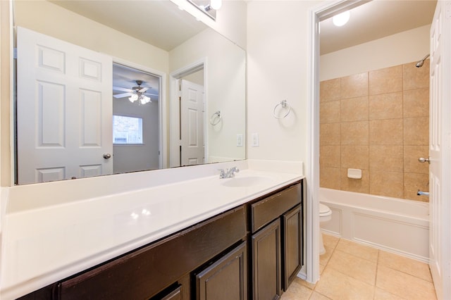 full bathroom featuring a ceiling fan, tile patterned flooring, vanity, toilet, and tub / shower combination