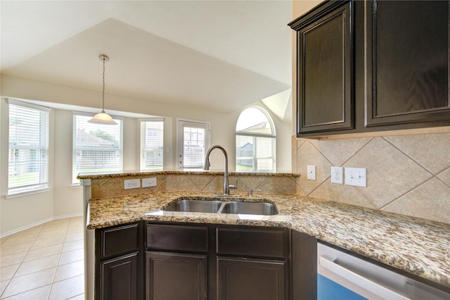 kitchen featuring a sink, a wealth of natural light, backsplash, and dishwasher