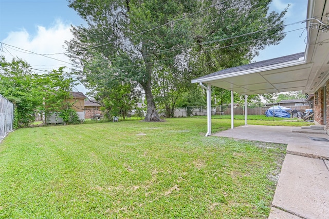 view of yard with a fenced backyard and a patio area