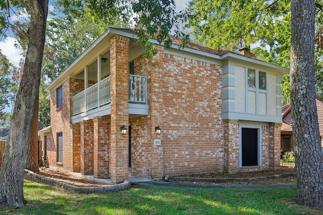 6531 Coral Ridge Rd, Houston, TX 77069 - exterior space with brick siding, a balcony, and a chimney