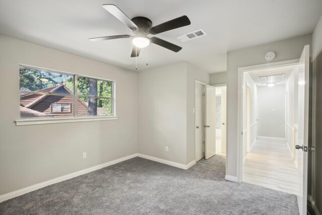 6531 Coral Ridge Rd, Houston, TX 77069 - unfurnished bedroom featuring carpet floors, attic access, a ceiling fan, baseboards, and visible vents