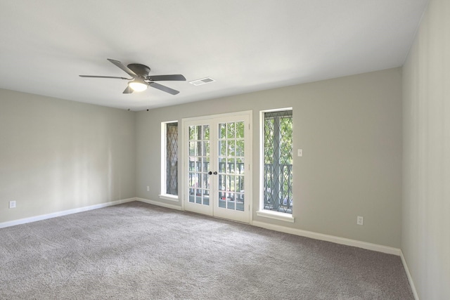 6531 Coral Ridge Rd, Houston, TX 77069 - carpeted spare room featuring a ceiling fan, baseboards, visible vents, and french doors