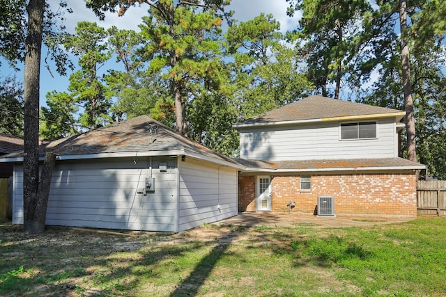 6531 Coral Ridge Rd, Houston, TX 77069 - rear view of property with fence, brick siding, a patio area, central air condition unit, and a yard