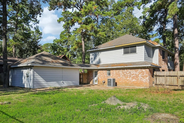 6531 Coral Ridge Rd, Houston, TX 77069 - rear view of house with a yard, brick siding, fence, and a patio