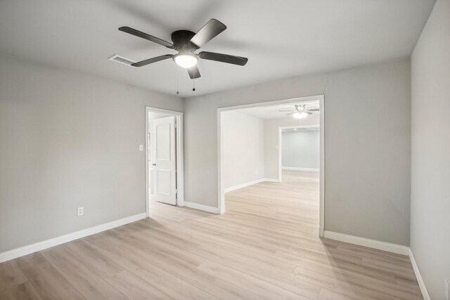 6531 Coral Ridge Rd, Houston, TX 77069 - unfurnished room with visible vents, baseboards, ceiling fan, and light wood finished floors