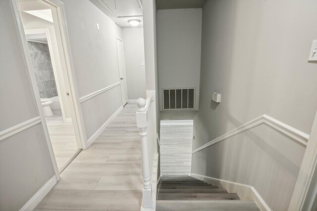 6531 Coral Ridge Rd, Houston, TX 77069 - stairs with attic access, wood finished floors, and visible vents