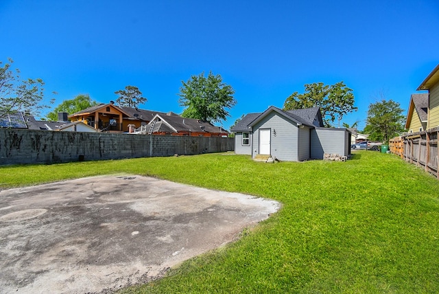 view of yard with a patio and a fenced backyard