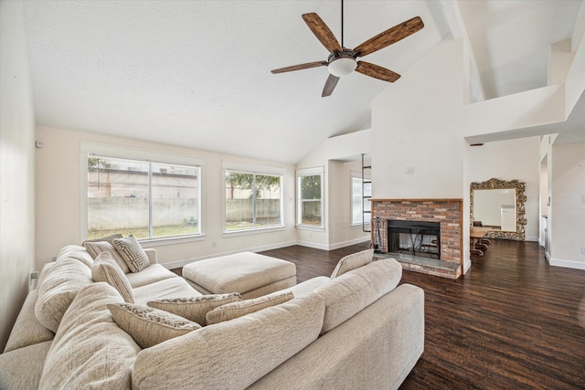 living area featuring a ceiling fan, baseboards, high vaulted ceiling, beamed ceiling, and dark wood-style floors