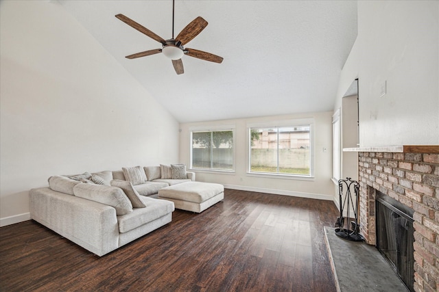 living room with a fireplace, high vaulted ceiling, dark wood finished floors, a ceiling fan, and baseboards