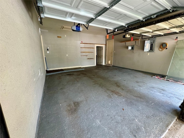 garage featuring a garage door opener and electric panel