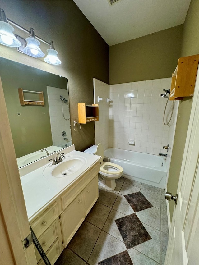 bathroom with vanity, tile patterned floors, bathtub / shower combination, and toilet