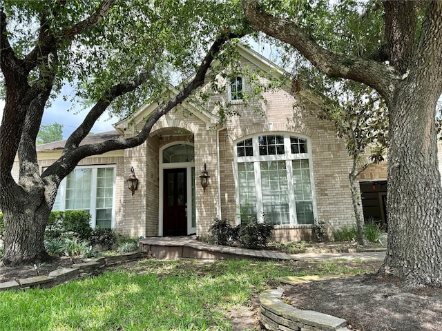 view of front of home with brick siding