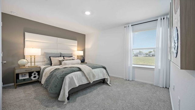 bedroom featuring carpet flooring and baseboards