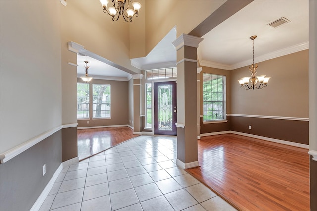 4103 Oak Blossom Ct, Houston, TX 77059 - entryway with an inviting chandelier, baseboards, crown molding, and visible vents