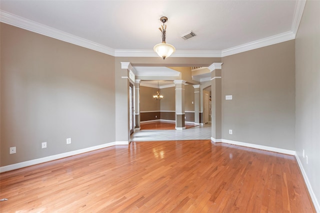 4103 Oak Blossom Ct, Houston, TX 77059 - unfurnished room featuring visible vents, crown molding, light wood-type flooring, a chandelier, and ornate columns