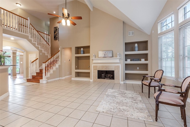 4103 Oak Blossom Ct, Houston, TX 77059 - living area with baseboards, a ceiling fan, high vaulted ceiling, and built in shelves