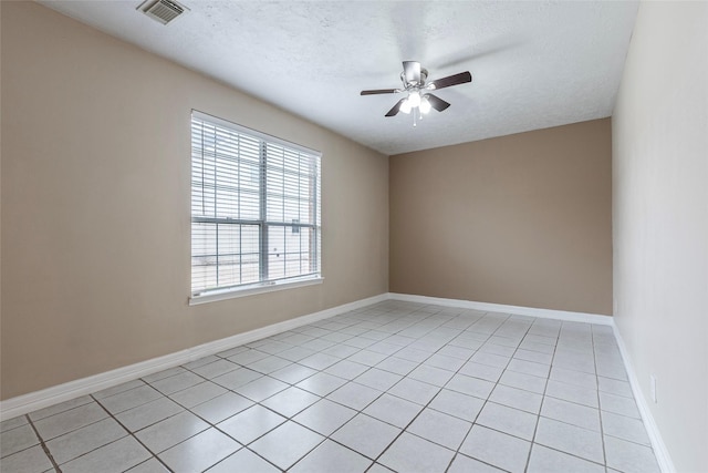 4103 Oak Blossom Ct, Houston, TX 77059 - spare room featuring visible vents, baseboards, a textured ceiling, a ceiling fan, and light tile patterned floors