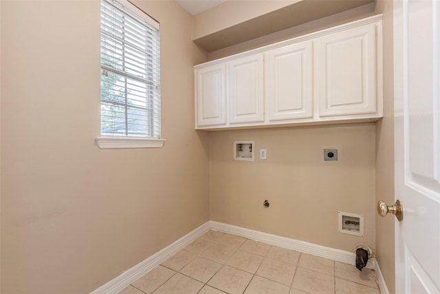 4103 Oak Blossom Ct, Houston, TX 77059 - laundry room featuring cabinet space, washer hookup, electric dryer hookup, baseboards, and light tile patterned floors
