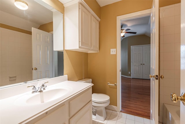 4103 Oak Blossom Ct, Houston, TX 77059 - bathroom featuring ceiling fan, tile patterned flooring, vanity, toilet, and lofted ceiling