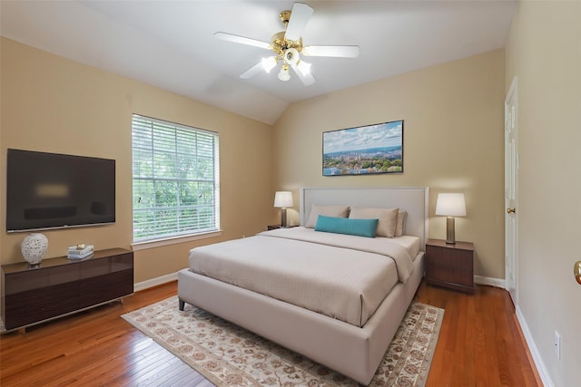 4103 Oak Blossom Ct, Houston, TX 77059 - bedroom with baseboards, ceiling fan, wood finished floors, and lofted ceiling