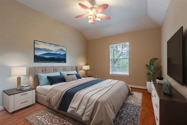 4103 Oak Blossom Ct, Houston, TX 77059 - bedroom featuring baseboards, ceiling fan, light wood-style flooring, and lofted ceiling