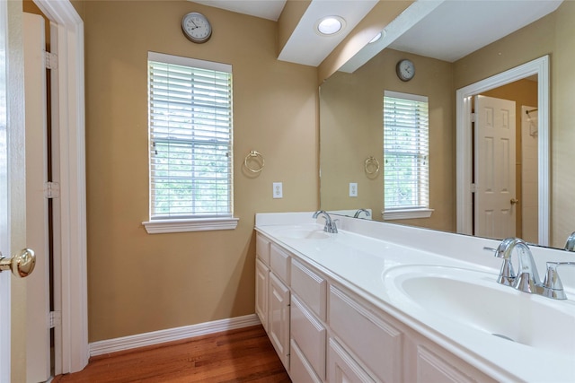 4103 Oak Blossom Ct, Houston, TX 77059 - full bath featuring double vanity, baseboards, a sink, and wood finished floors