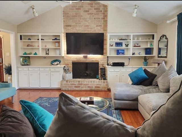 11303 Olympia Dr, Houston, TX 77077 - living room with light wood-style floors, a fireplace, and lofted ceiling