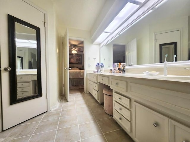11303 Olympia Dr, Houston, TX 77077 - ensuite bathroom with tile patterned floors, ensuite bathroom, vanity, and ceiling fan
